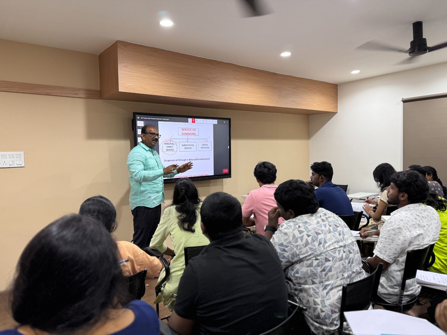 Advocates studying legal documents — VLS Law Academy